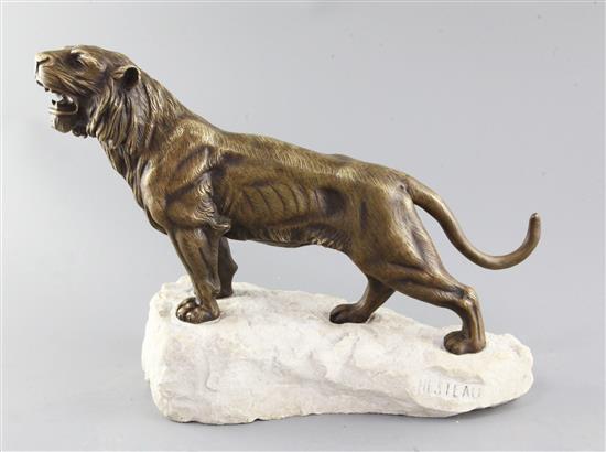Louis Hesteaux. An Art Deco bronze model of a roaring tiger, height 11in. length 14in.